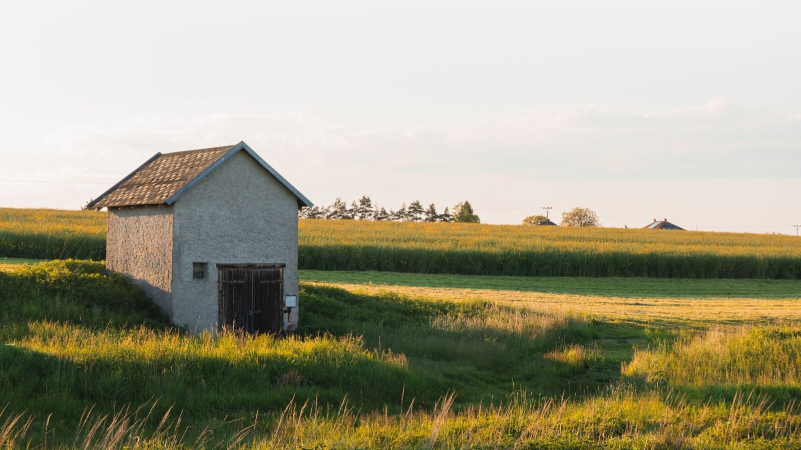 A quaint small building in a serene rural landscape in Zbraslavice, Czech Republic.
